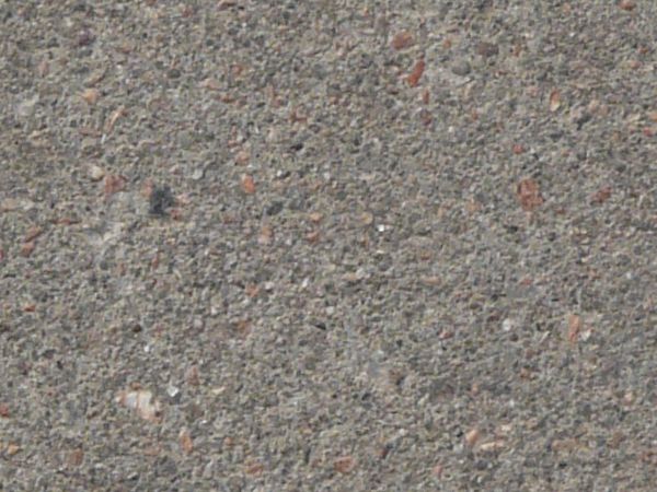 Flat road texture of asphalt in consistent, grey tone with even surface.